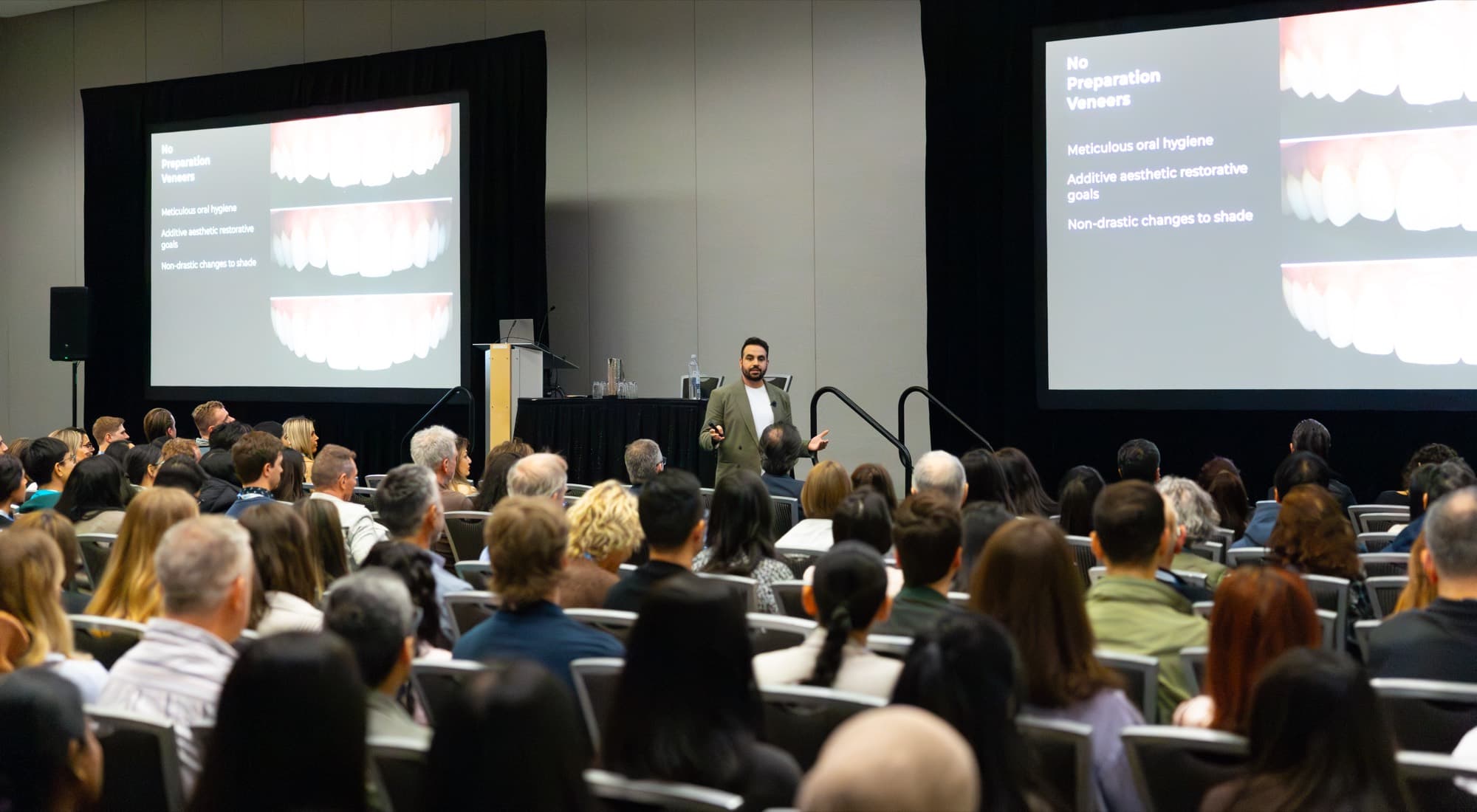 Dr. Faraj Edher lecturing to a packed conference hall